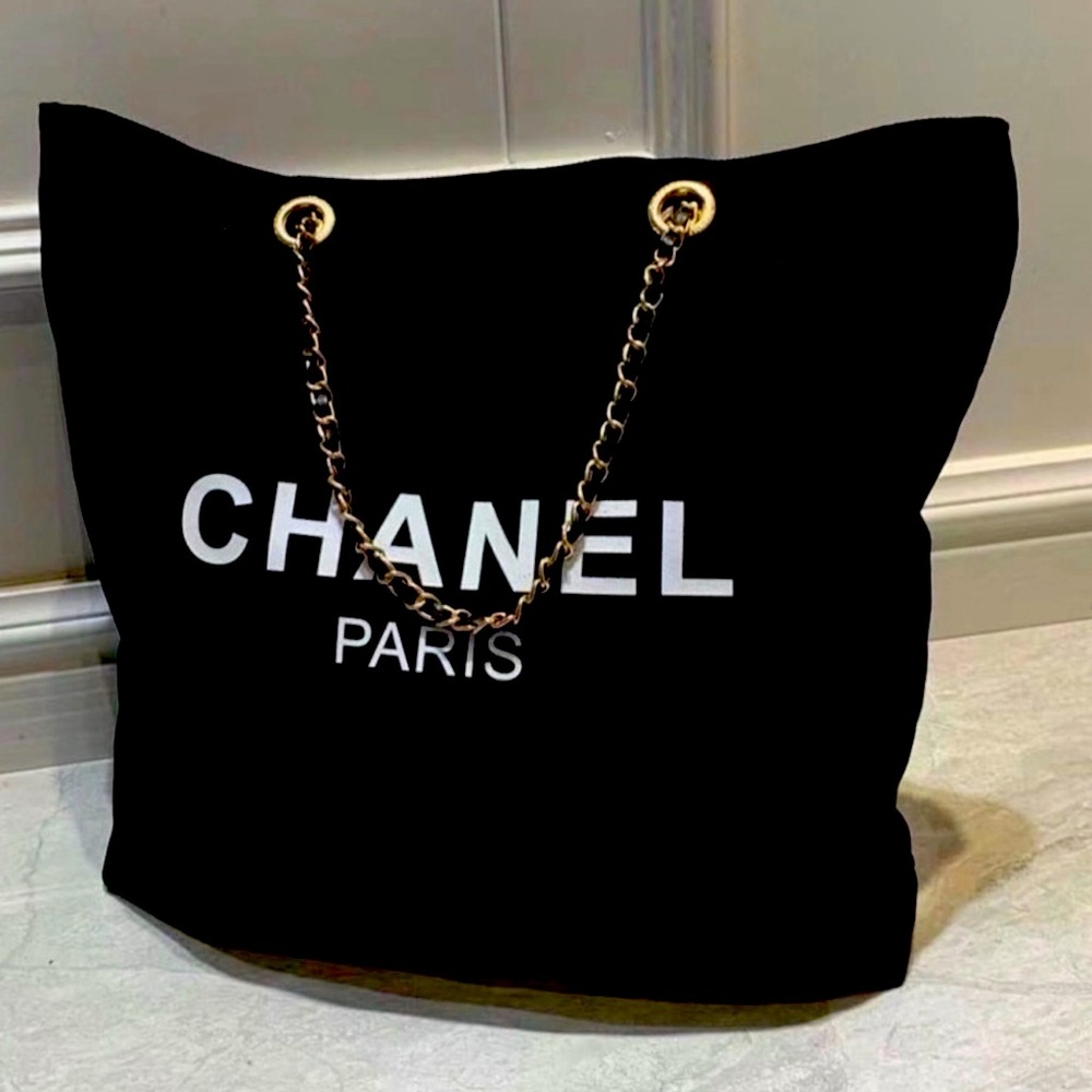Chanel black Tote with Gold Chain! It's a gift of purchase.